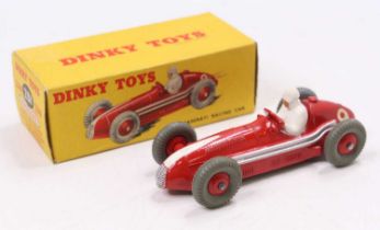 A Dinky Toys No. 231 Maserati racing car, comprising red body with racing No. 9, and red hubs,