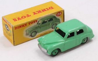 Dinky Toys 154 Hillman Minx Saloon,Green body and hubs, in original correct colour spot box, (VG-