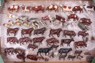 A collection of Britains and similar lead hollow cast farming miniatures to include bulls, cows,