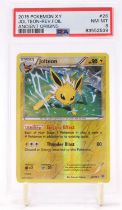 A PSA Graded 2015 Pokemon X and Y Ancient Origins "Jolteon" in reverse foil number 26/98 graded NM-