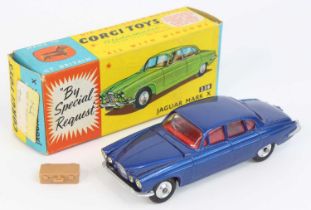 Corgi Toys No. 238 Jaguar Mk 10 comprising of a metallic dark blue body with red interior and spun