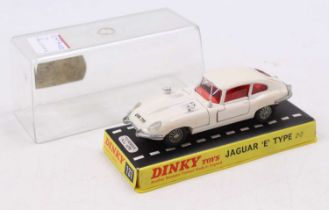 A Dinky Toys No. 131 Jaguar E-type comprising white body with red interior and silver wheels, housed