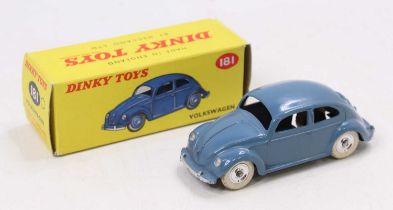 A Dinky Toys No. 181 Volkswagen comprising dark blue body with silver spun hubs, housed in the