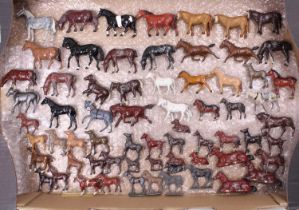 A collection of Britains and other farming lead hollow cast miniatures to include various horses &