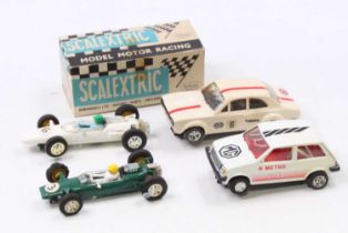 Four various loose Scalextric slot racing cars to include the C052 Ford RS 1600 race car, the