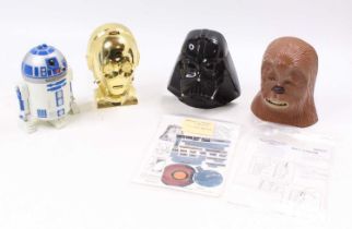 A collection of four various Star Wars Micro Machines gift sets, one of R2D2, Chewbacca, C3PO, and