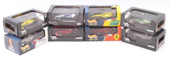 Eight Hotwheels F1 1/43 scale diecast models to include Jordan 199 Damon Hill, Jaguar Eddie Irvine