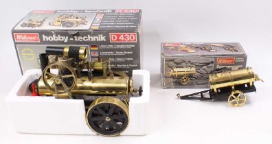 A Wilesco D430 Hobby-Technik locomobile comprising gold and black body, housed in the original