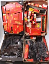 Four large trays containing 00 gauge 2-rail track. Some boxed, some not. Various makes and eras.