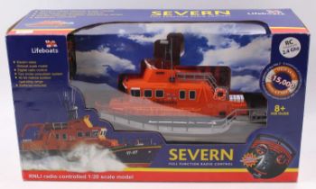 A radio controlled 1/20 model of a RNLI Severn Boat in orange, housed in the original card and