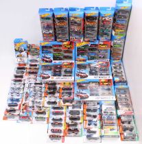 Two boxes containing a quantity of Matchbox and Hotwheels modern release carded diecast miniatures