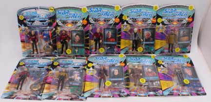 A box containing Star Trek The Next Generation action figures by Playmates, to include Captain