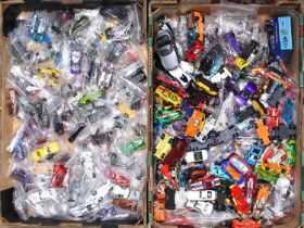 Two trays containing a quantity of Hotwheels diecast vehicles, mixed series and ranges included