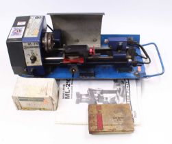 A Record ML-210 Table Top Lathe, with booklet and tin of spares/tools Unable to test this item.