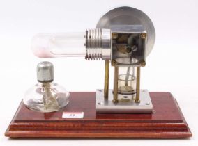 A scratch-built Sterling Cycle Hot Air engine comprising of glass heat exchange with open crankshaft