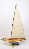 A very well made 1960s wooden hull pond yacht, hand painted in white with stained wooden deck,