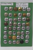 A large collection of Omnibus buttons, a display card of 48 individual buttons and the majority in