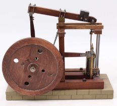 A very well engineered wooden and base metal model of a stationary beam engine, comprising of
