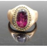 A circa 1900 yellow metal and garnet(?) set signet ring, unmarked but tests as approx 9ct gold, 5.