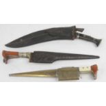 A vintage kukri with leather sheath, together with two Afghan Khyber knives (3)