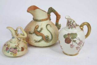 A Royal Worcester blush ivory jug, No. 1714, decorated with a lizard, h.16cm; together with two