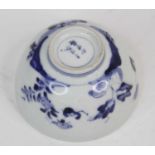 A Chinese blue and white porcelain bowl, decorated with flowers, six character mark to the base,