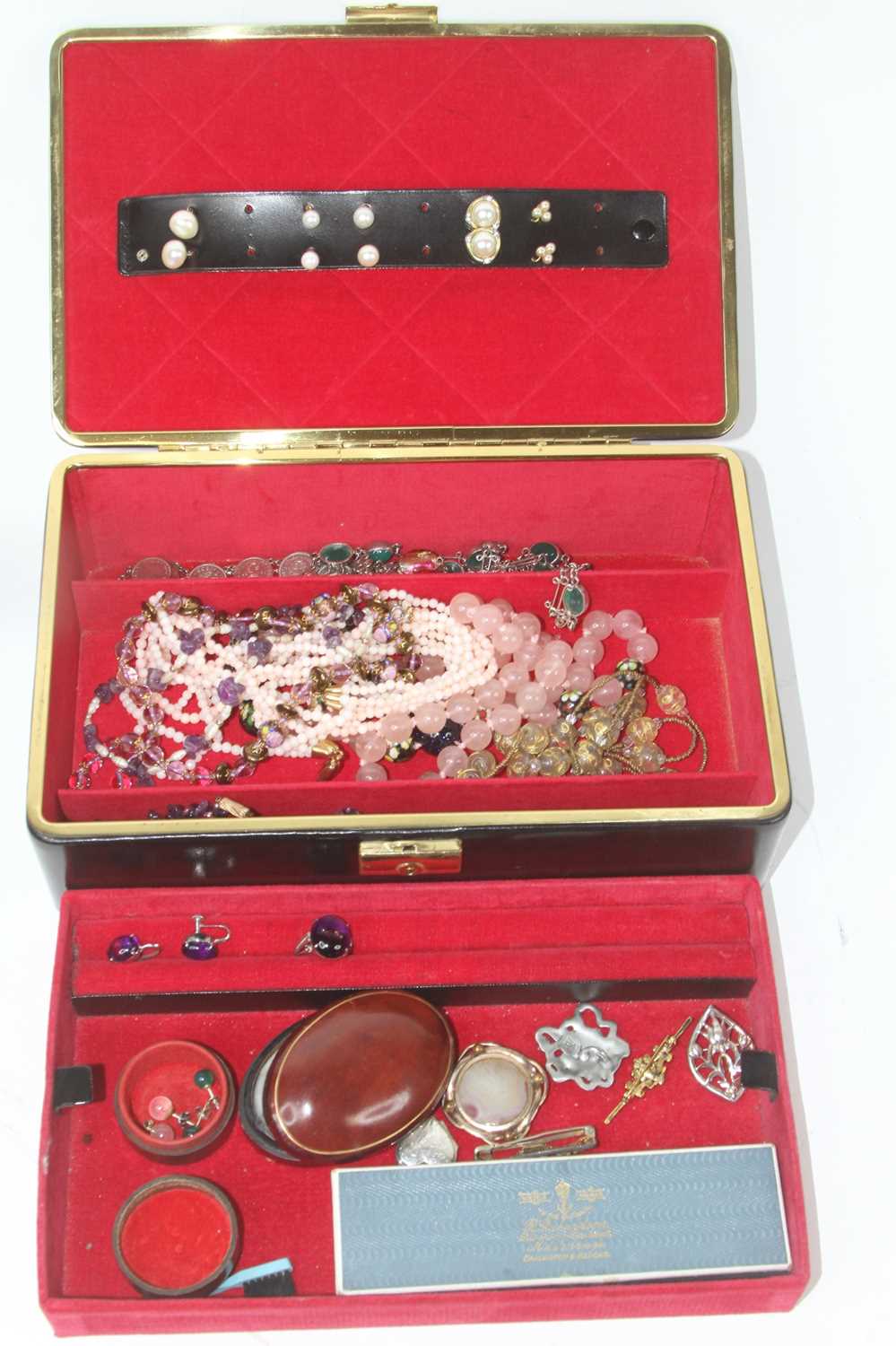 A collection of costume jewellery to include beaded necklaces, rings and brooches