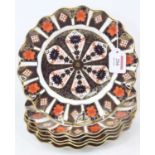 A set of six Royal Crown Derby 1128 pattern imari porcelain plates, having wavy rims, dia.22cm