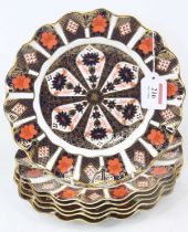 A set of six Royal Crown Derby 1128 pattern imari porcelain plates, having wavy rims, dia.22cm