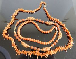 A natural coral long necklace, 70cm; together with a beaded coral single string necklace with yellow