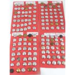 An Exstensive collection of Fire & Ambulance Uniform buttons arranged alphabetically A-D, E-L, M-S &