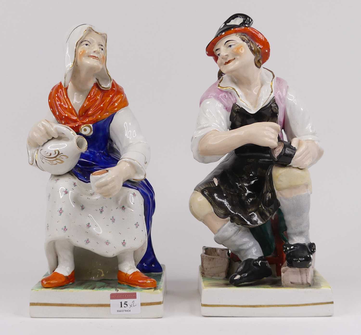 A pair of Victorian Staffordshire pottery figures of cobblers, each height 32cm