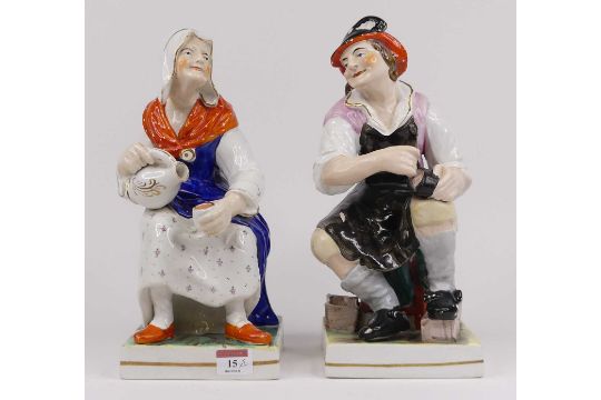 A pair of Victorian Staffordshire pottery figures of cobblers, each height 32cm