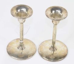 A pair of Elizabeth II weighted silver candlesticks, of plain circular form, maker LJ Millington,