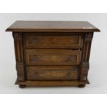 A miniature apprentice type oak chest of three drawers, width 30cm