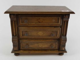 A miniature apprentice type oak chest of three drawers, width 30cm