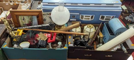 Two boxes of miscellaneous items, to include a brass oil lamp, clock dials, guitar hangers etc