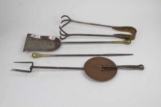 A collection of antique fire tools