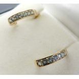 A pair of modern 9ct gold and green topaz set earrings, on post fittings, 2.3g, 1.5cm