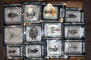 A tray containing Star Wars figures to include Millennium Falcon, Tie Fighter pilot, etc