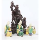 A collection of three Chinese Sancai glazed earthenware figures, the largest h.11cm; together with a