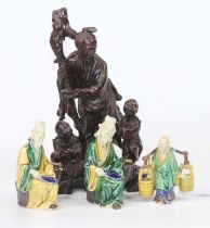A collection of three Chinese Sancai glazed earthenware figures, the largest h.11cm; together with a