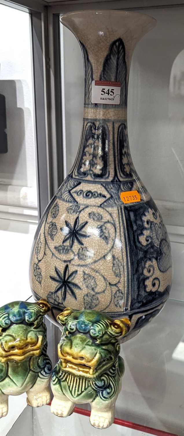 A Chinese blue & white crackle glazed vase, height 33cm, together with a pair of Sancai glazed