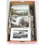 A collection of vintage postcards to include portrait and topographical examples