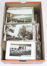 A collection of vintage postcards to include portrait and topographical examples