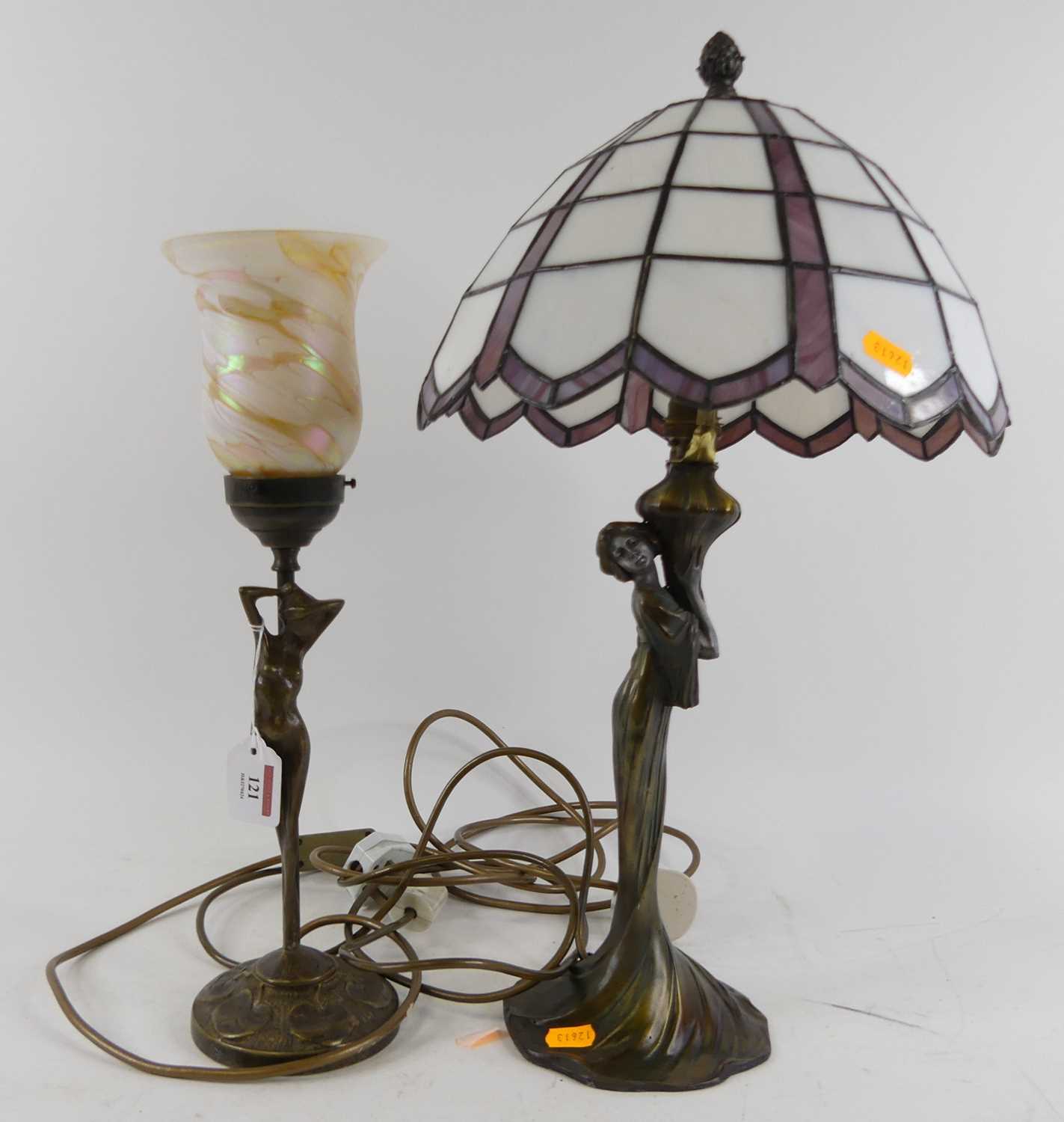 A bronzed metal figural table lamp, having a coloured glass shade, height 42cm, together with