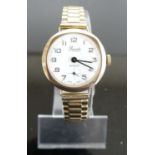 A Precista lady's 9ct gold cased vintage manual wind wristwatch, on gilt metal bracelet, case dia.