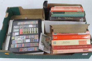A collection of mixed stamps and Stanley Gibbons catalogues