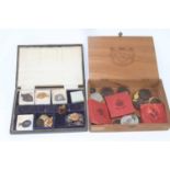 A collection of badges, coinage and medallions, to include a boxed 1935 commemorative medal, Rifle