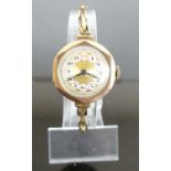 A 9ct gold lady's vintage manual wind wristwatch, on 9ct expanding link bracelet, gross weight 16.